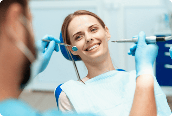 woman-sits-dental-chair-doctors-bowed-her